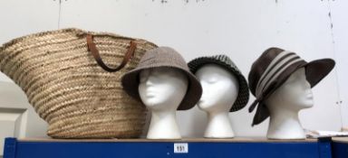 A quantity of hats and a wicker shopping bag (heads not included)