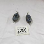 A pair of enamelled ear pendants.