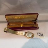 A 9ct gold cased Garrard gent's wristwatch, dedicated and in original case.