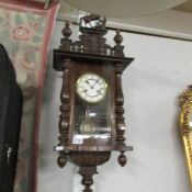 A mahogany wall clock.