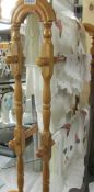 A 20th century pine towel rail and linen.