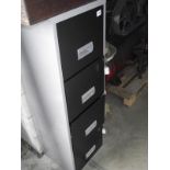 A metal 4 drawer filing cabinet