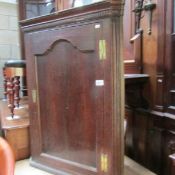 An oak corner cupboard.