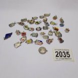 36 silver and enamel charms principally of town and city crests and a 1901 3d bit (approximately 49