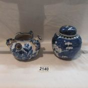 A blue and white oriental ginger jar and a blue and white delft style pot.