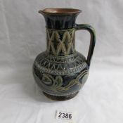 An 1876 Doulton Lambeth pitcher with marks for Florence Barlow.