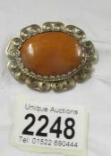 An amber brooch.