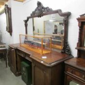 A Victorian double pedestal mirror backed sideboard.