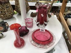 A quantity of cranberry glass items including vase