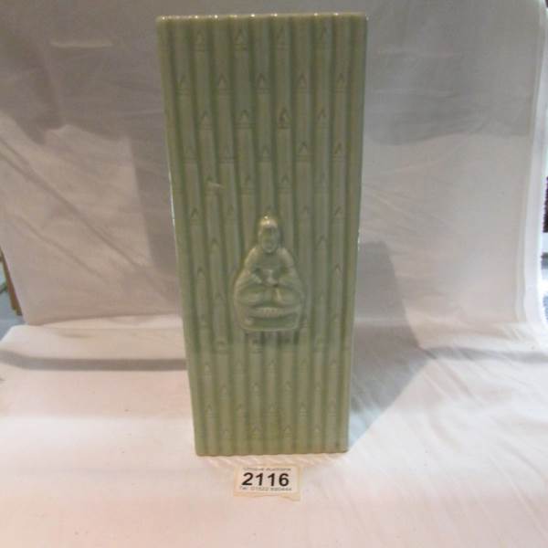 A late 19th century Chinese green pottery brush pot.