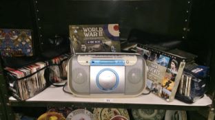 A Sony radio cassette player & quantity of CD's & a pair of DVD box sets