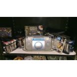 A Sony radio cassette player & quantity of CD's & a pair of DVD box sets