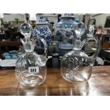 2 glass jugs with stoppers