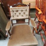 An Edwardian mahogany inlaid arm chair.