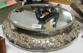An ornate silver plated wedding cake stand with mirror top (mirror a/f).