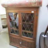 An oak lead glazed book case.