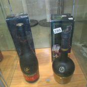 A bottled of Remy Martin and a bottle of Corvoisier.