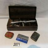 An early 20th century gramaphone needle sharpener with needle tins.