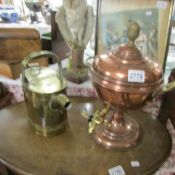 A copper samovar urn and a brass hot water can.