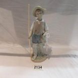 A Lladro fishing boy.