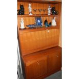 A teak effect wall unit