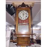 A Victorian American inlaid wall clock