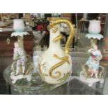 A Royal Worcester jug a/f and a pair of figural candlesticks.