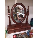 A stained pine toilet mirror with drawer