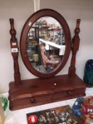 A stained pine toilet mirror with drawer