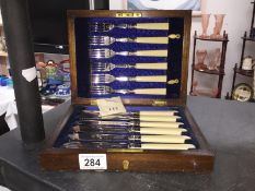 A cased set of fish knives and forks