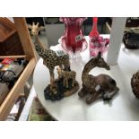 2 giraffe figurines