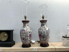 A pair of 20th Century ceramic table lamps in the style of vases with gilt and floral decoration