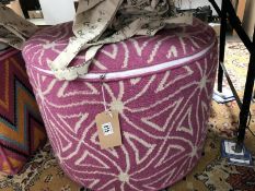 An Amy Kent pouffe (round pink design)