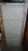 A 4 drawer filing cabinet with key