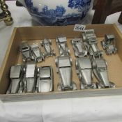 A quantity of pewter model cars.