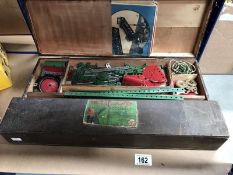 A quantity of Meccano items in wooden box