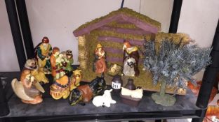 An unusual pottery 'Nativity' stable and figurines