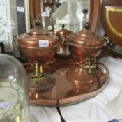 A large oval copper gallery tray and 2 copper samovar urns.