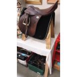A horse saddle with maker's madge 'W. Brookes product W.B. & S.