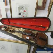 An old cased violin, a/f.