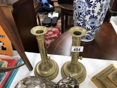 A pair of push up candlesticks