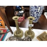 A pair of push up candlesticks