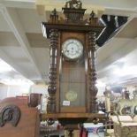 A mahogany wall clock,