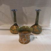 A pair of Royal Doulton vases and a small Royal Doulton pot.