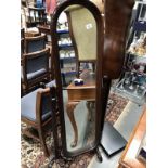 A floor standing dressing mirror