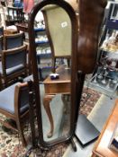 A floor standing dressing mirror