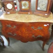 A marquetry inlaid and boulle bombe chest with marble top.