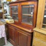 A Victorian mahogany glazed top book case.