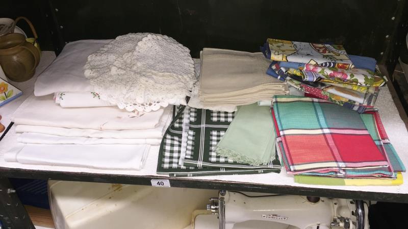 A quantity of tablecloths, napkins, tea towels etc.