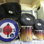 A Maypex prom bass drum with 2 floor Toms and drum stands.